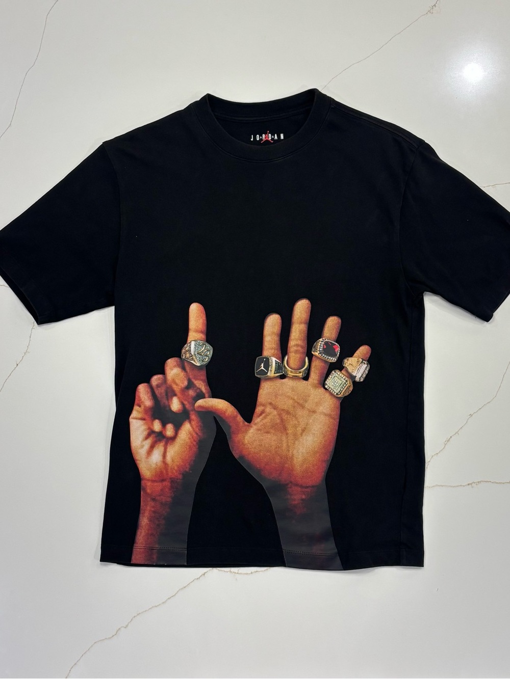 Jordan Black Short Sleeve Tee with Ringed Hands Graphic